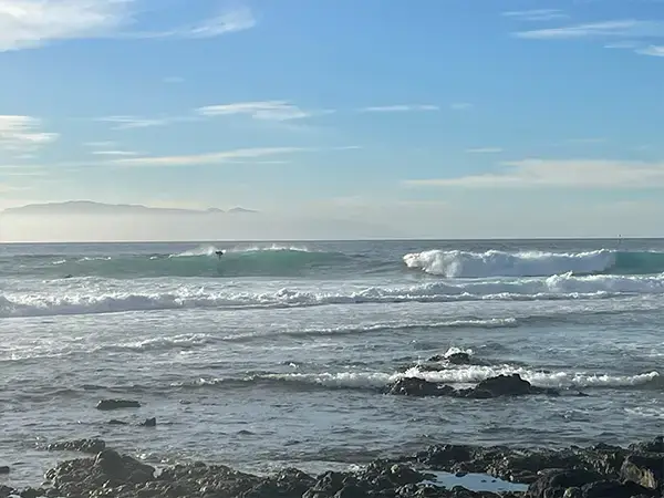 Surfer take off at El Dedo, this is one of the least crowded spots along with la Fitenia, because it is so shallow.